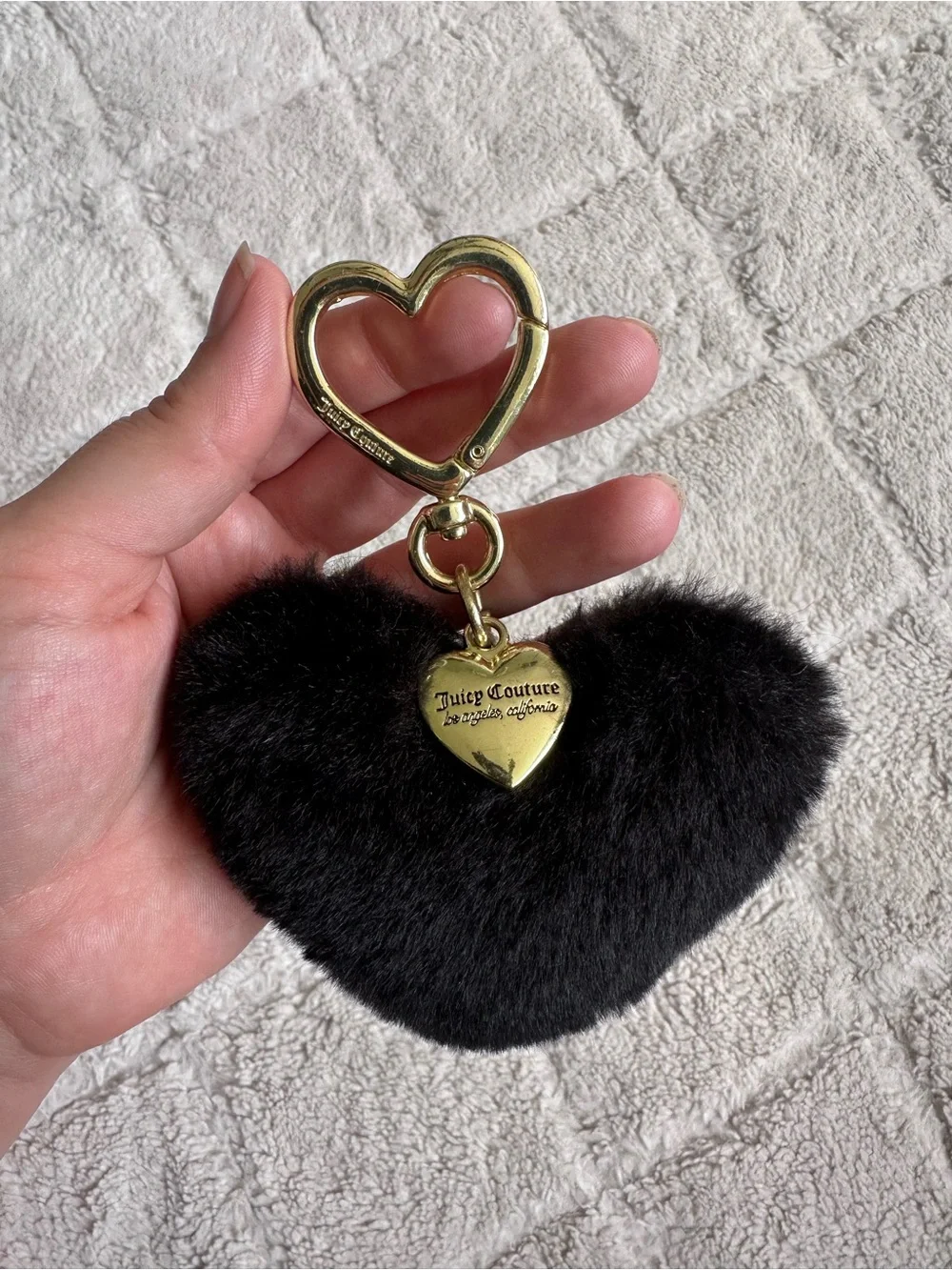 Juicy Couture | Black faux fur heart keychain charm featuring gold-tone Hardwear